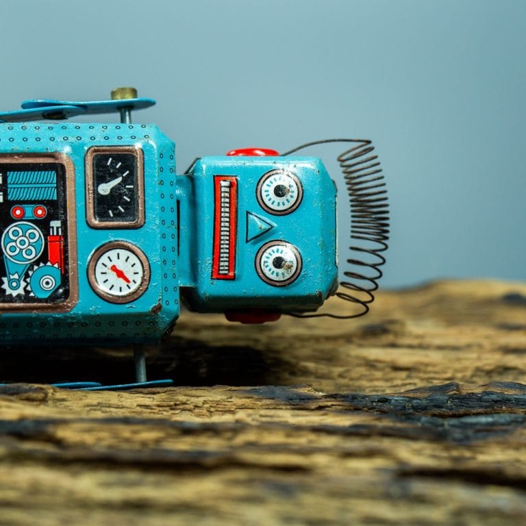 Sad robot lying down broken