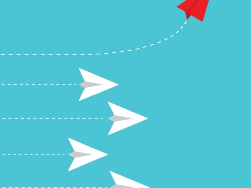 Red paper airplane changing direction